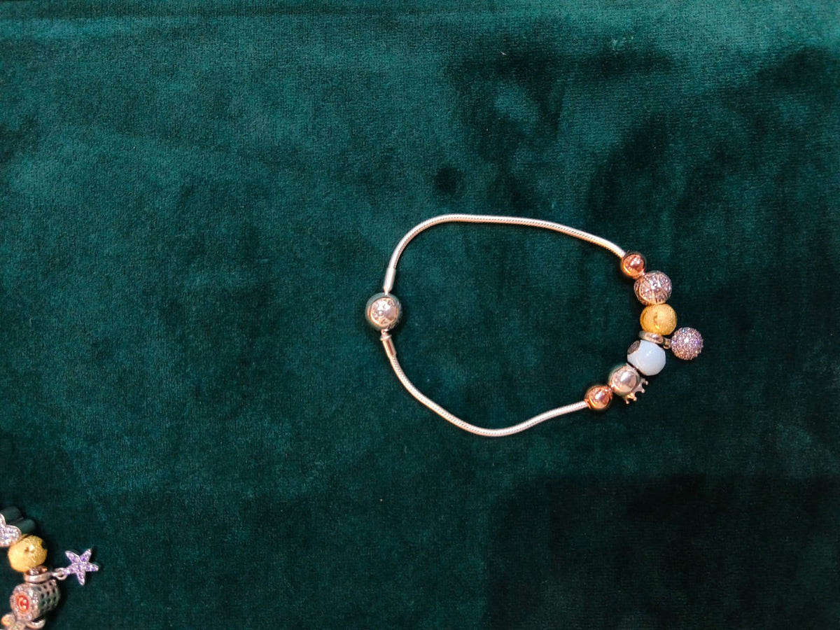 925 silver rose gold glitter charm bracelet on teal velvet