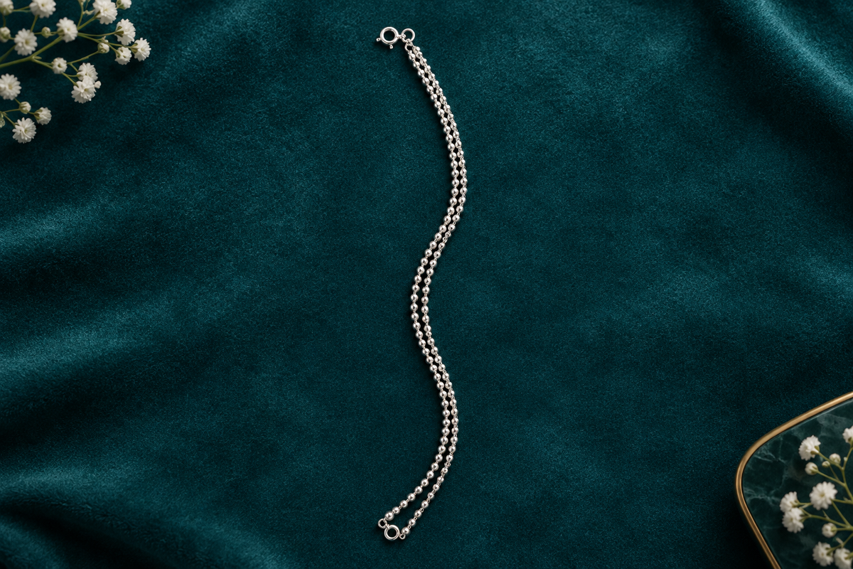 925 silver ball bead anklet flat lay on teal velvet