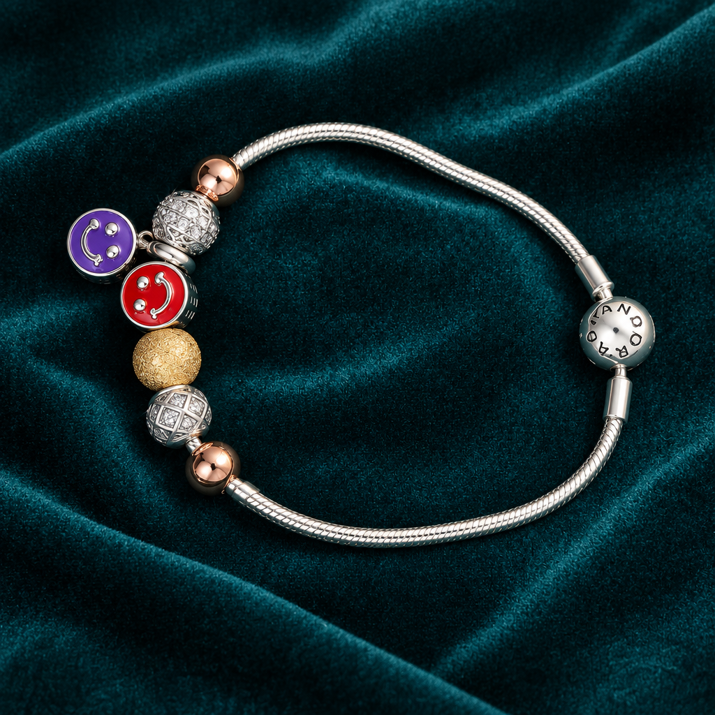925 silver smiley charm bracelet flat lay on teal velvet
