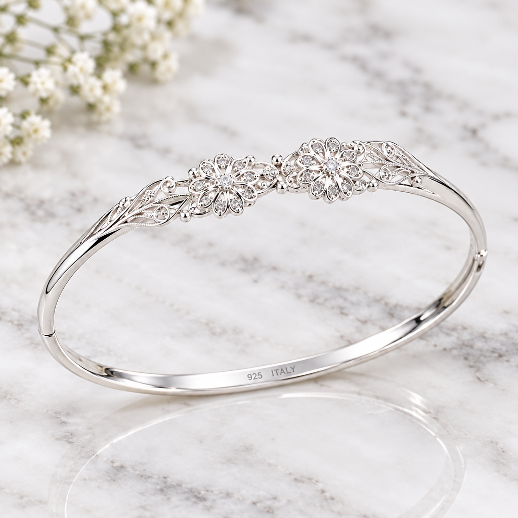 925 Italian silver girls bangle close-up on marble