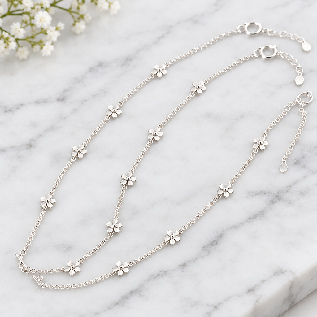 925 silver daisy anklet close-up on marble