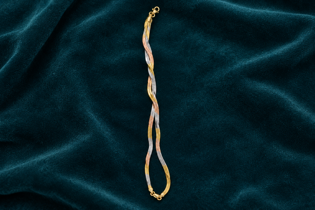 925 silver tri-tone snake anklet flat lay on teal velvet
