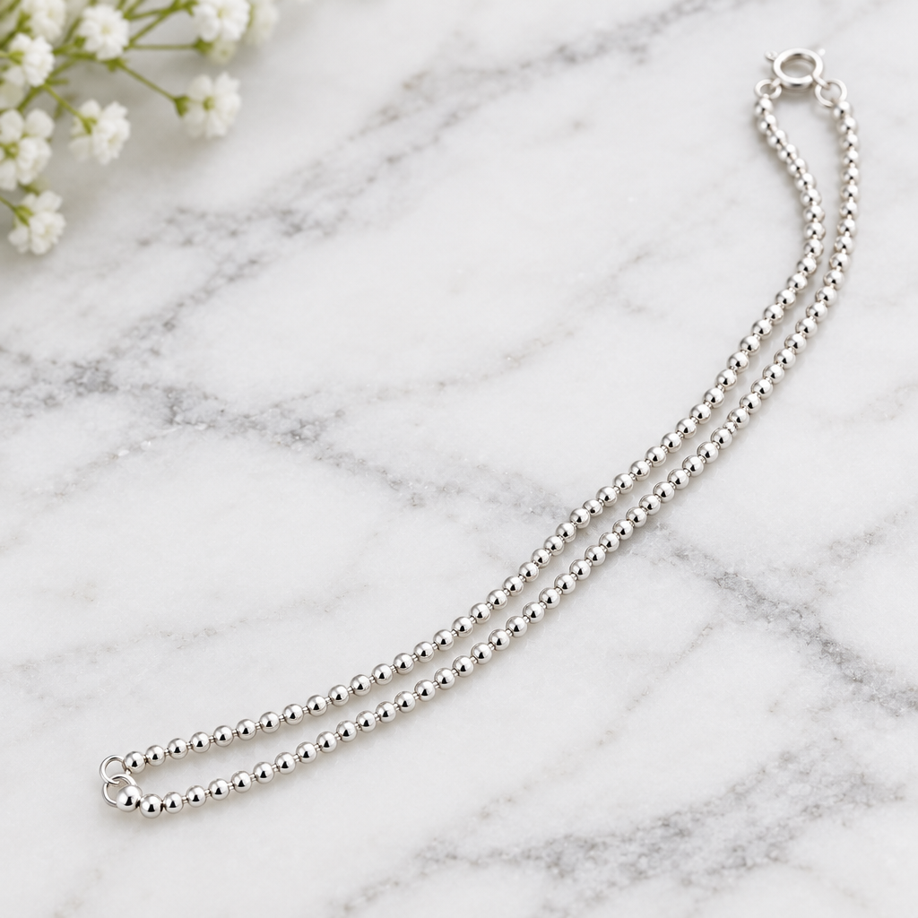 925 silver ball bead anklet close-up on marble
