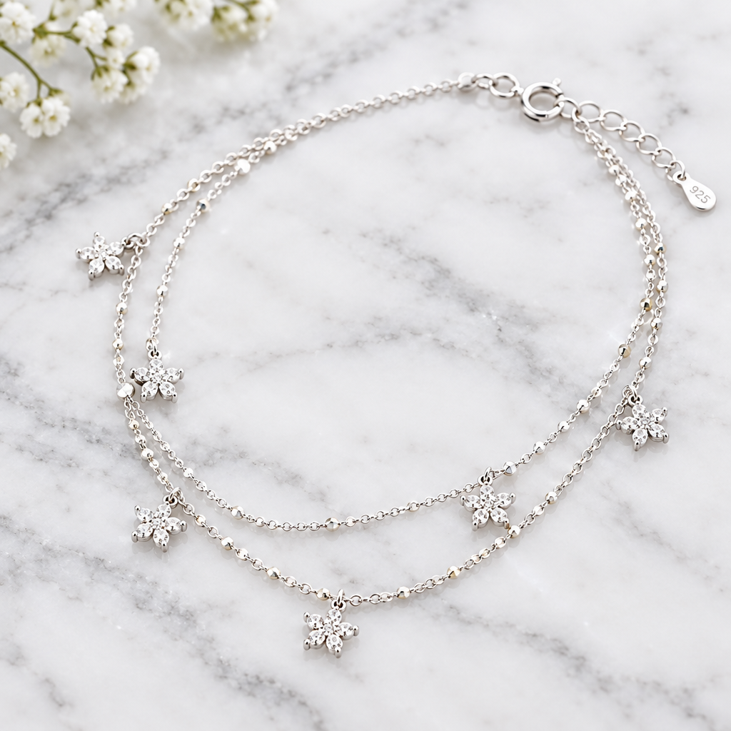 925 silver snowflake charm anklet close-up on marble