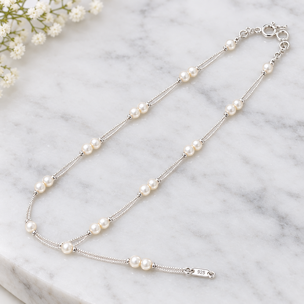 925 silver pearl anklet close-up on marble