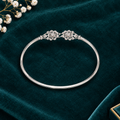 925 Italian silver girls bangle flat lay on teal velvet