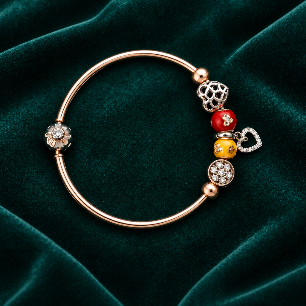 925 silver rose gold charm bangle flat lay on teal velvet
