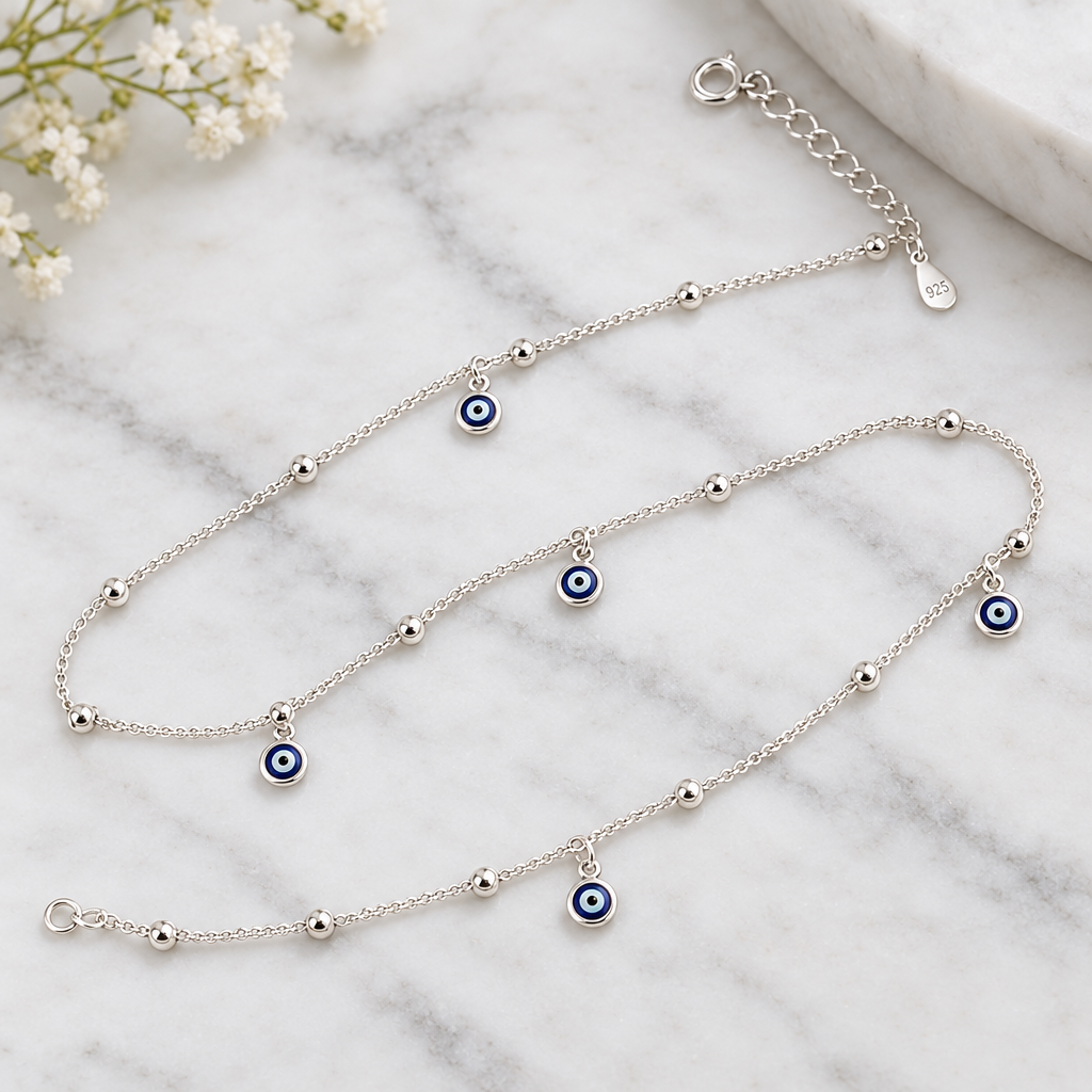 925 silver evil eye anklet close-up on marble