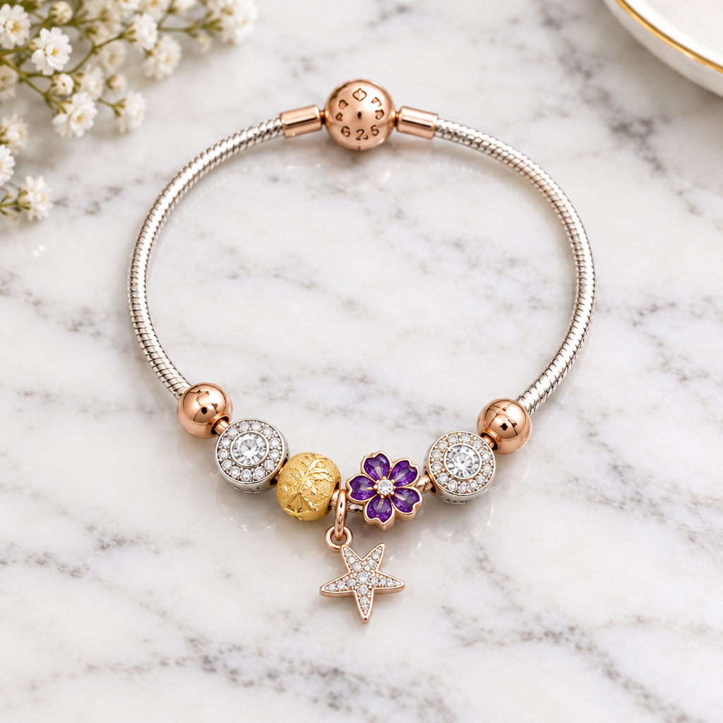 925 silver rose gold charm bracelet close-up on marble