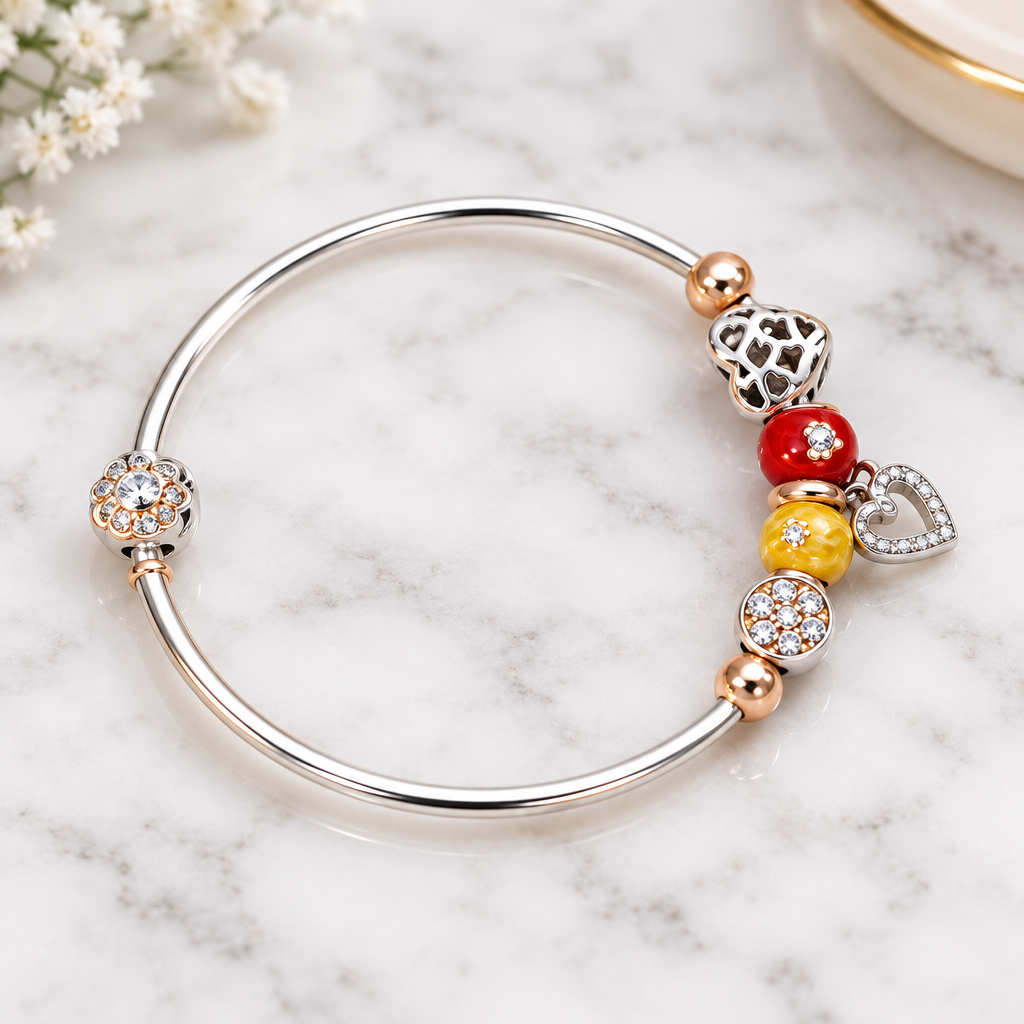 925 silver rose gold charm bangle close-up on marble